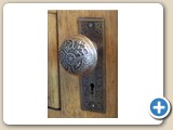 Original elaborate brass doorknobs, hinges and hardware can be found throughout the house