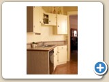Kithcen with 1940's restored kitchen cabinets from gutted apartments in the house